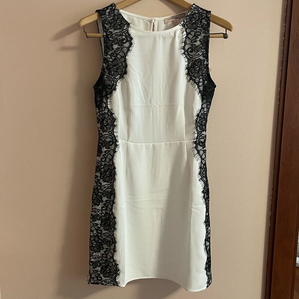 Formal white dress with black lace details